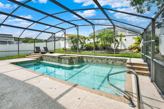 737 Oxford Dr, Davenport, FL 33897 - view of pool with a fenced backyard, a pool with connected hot tub, a patio, and a lanai