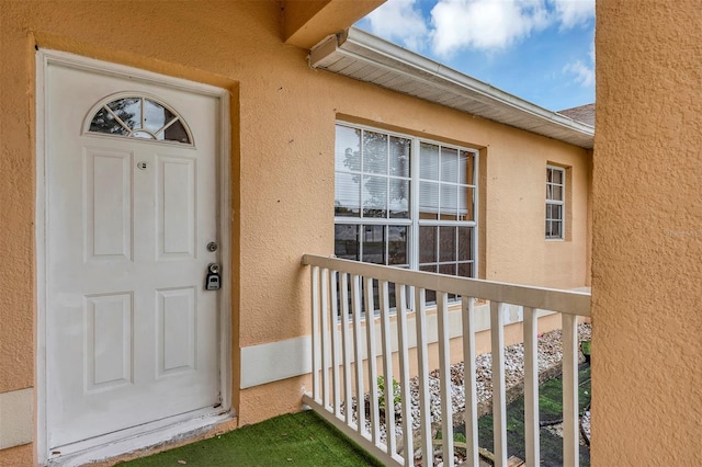 600 Regency Way, Kissimmee, FL 34758 - view of exterior entry with stucco siding and a balcony