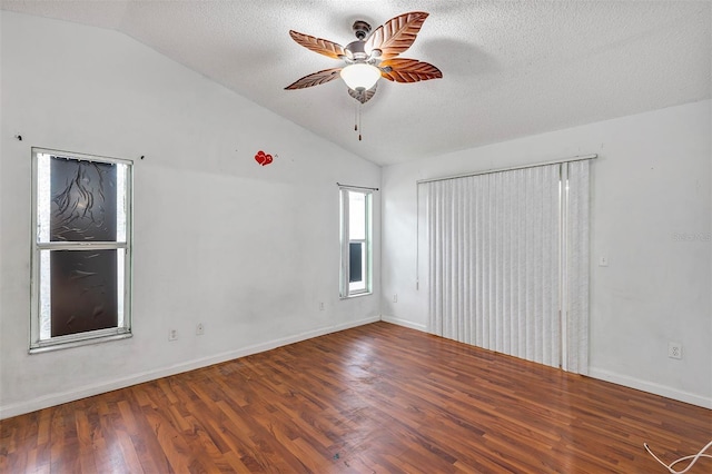 600 Regency Way, Kissimmee, FL 34758 - spare room with vaulted ceiling, ceiling fan, wood finished floors, and a textured ceiling