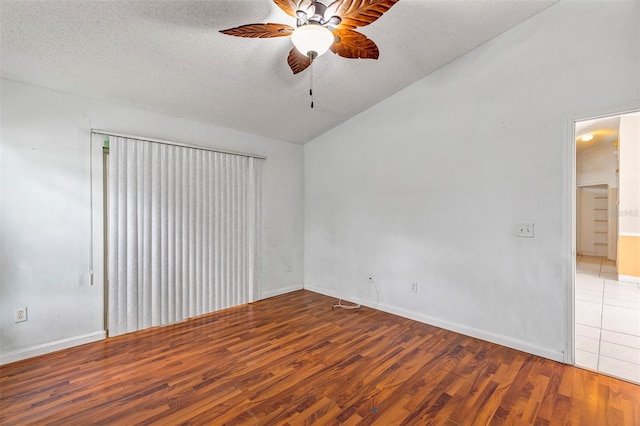 600 Regency Way, Kissimmee, FL 34758 - spare room with wood finished floors, a ceiling fan, lofted ceiling, and a textured ceiling