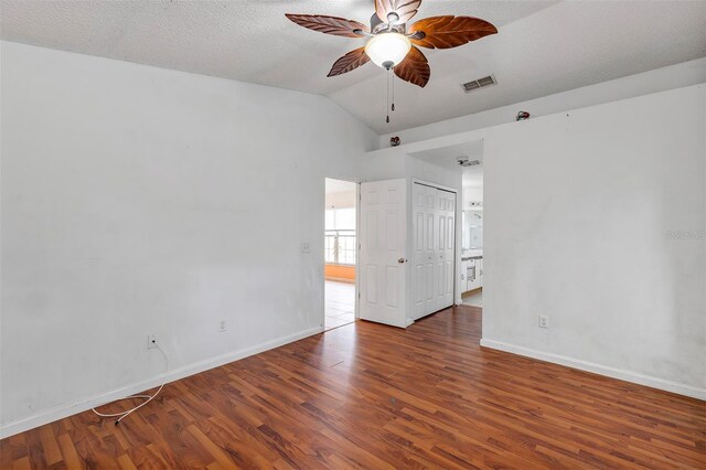 600 Regency Way, Kissimmee, FL 34758 - unfurnished room with vaulted ceiling, wood finished floors, and ceiling fan