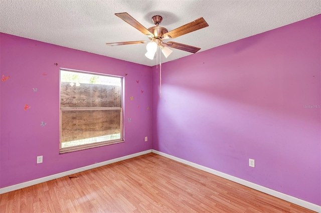 600 Regency Way, Kissimmee, FL 34758 - unfurnished room featuring wood finished floors, a textured ceiling, and ceiling fan
