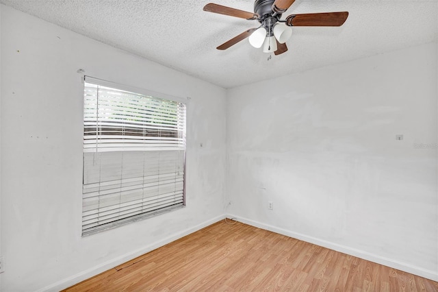 600 Regency Way, Kissimmee, FL 34758 - empty room with a textured ceiling, light wood-style flooring, and ceiling fan