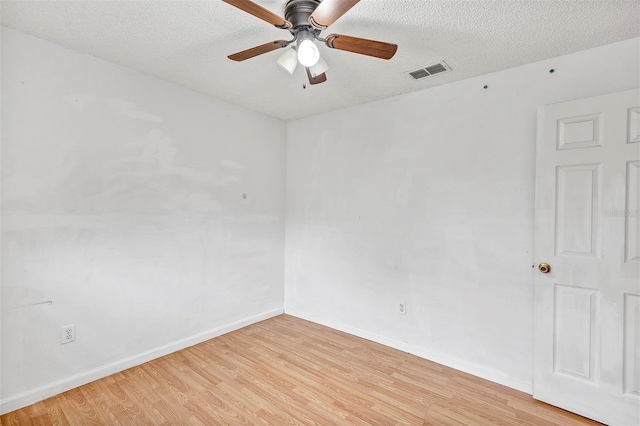 600 Regency Way, Kissimmee, FL 34758 - empty room with light wood-type flooring, ceiling fan, and a textured ceiling