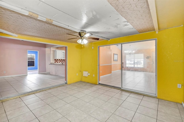 600 Regency Way, Kissimmee, FL 34758 - tiled spare room featuring ceiling fan and a chandelier