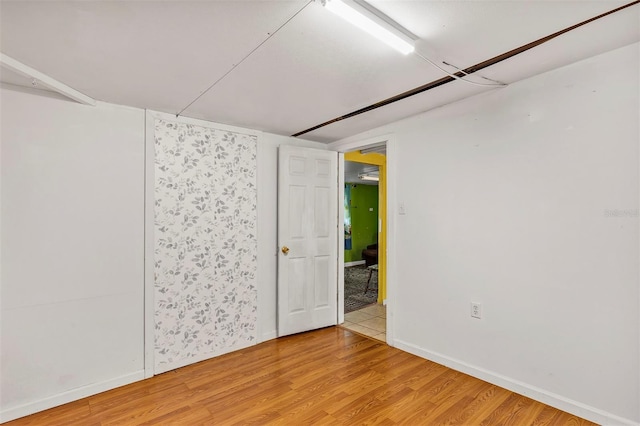 600 Regency Way, Kissimmee, FL 34758 - spare room featuring light wood-type flooring and baseboards