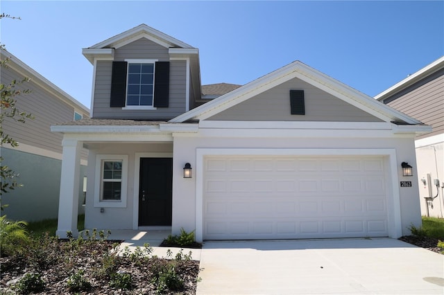 2863 Big Sur Rd, Davenport, FL 33837 - view of front of home featuring driveway, an attached garage, roof with shingles, and stucco siding