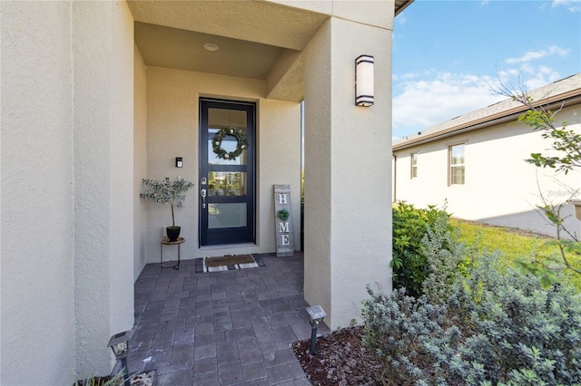 3224 Oxbow Ct, Harmony, FL 34773 - view of exterior entry featuring stucco siding