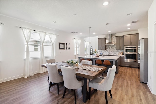 3224 Oxbow Ct, Harmony, FL 34773 - dining space with light wood-style floors, recessed lighting, and baseboards