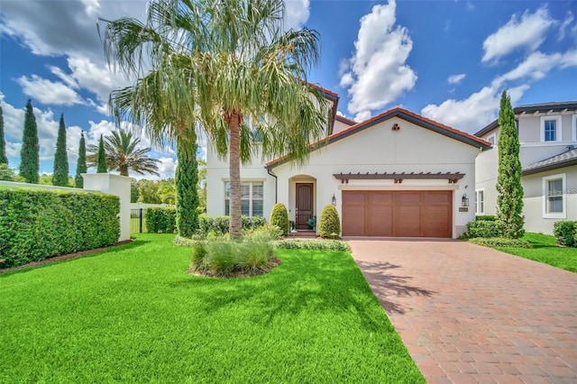 10836 Royal Cypress Way, Orlando, FL 32836 - mediterranean / spanish-style home featuring decorative driveway, a garage, a front lawn, and stucco siding