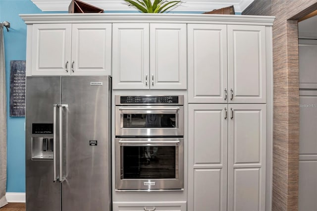 10836 Royal Cypress Way, Orlando, FL 32836 - kitchen featuring stainless steel appliances and white cabinets