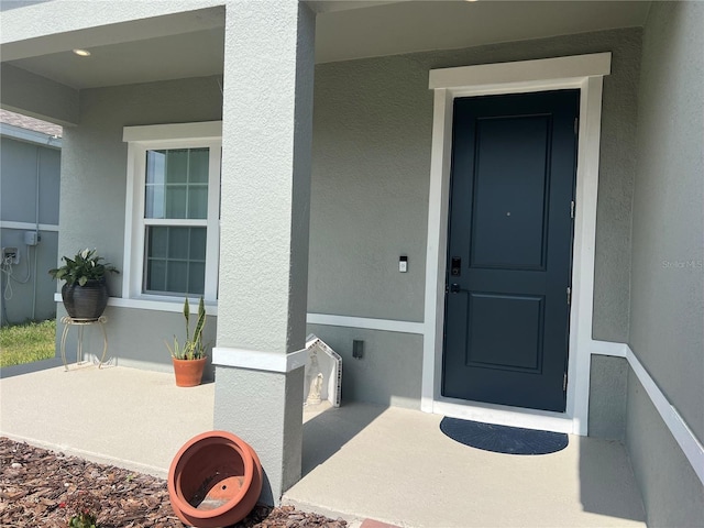 1896 Basenji Dr, Lake Alfred, FL 33850 - view of exterior entry with stucco siding
