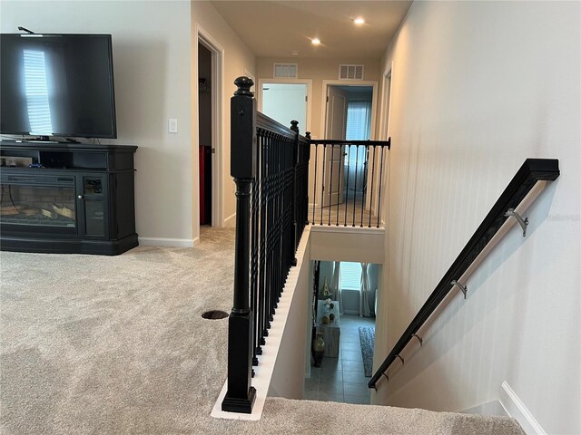 1896 Basenji Dr, Lake Alfred, FL 33850 - stairs featuring baseboards, carpet flooring, recessed lighting, and plenty of natural light