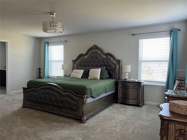 1896 Basenji Dr, Lake Alfred, FL 33850 - bedroom featuring light colored carpet, multiple windows, a textured ceiling, and baseboards