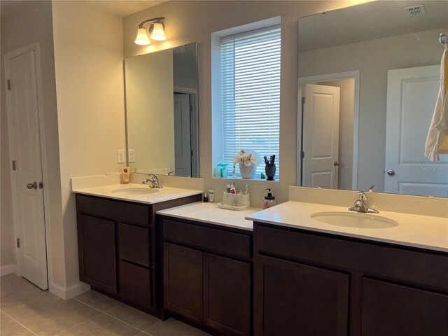 1896 Basenji Dr, Lake Alfred, FL 33850 - full bathroom featuring tile patterned flooring and two vanities