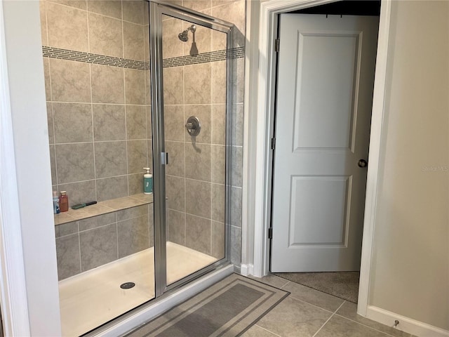 1896 Basenji Dr, Lake Alfred, FL 33850 - full bath featuring a shower stall, tile patterned flooring, and baseboards
