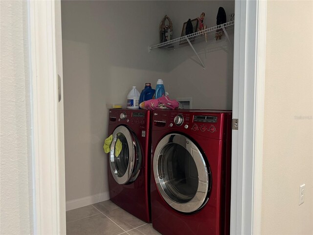 1896 Basenji Dr, Lake Alfred, FL 33850 - washroom with separate washer and dryer, tile patterned flooring, and baseboards