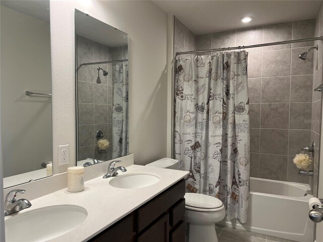 1896 Basenji Dr, Lake Alfred, FL 33850 - full bathroom with toilet, shower / tub combo with curtain, double vanity, and tile patterned floors