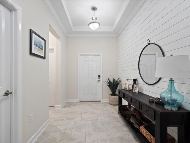3052 Prelude Ln, Kissimmee, FL 34746 - entrance foyer featuring a raised ceiling, baseboards, crown molding, and stone finish flooring