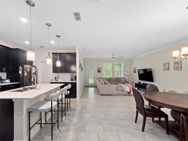 3052 Prelude Ln, Kissimmee, FL 34746 - dining space featuring ceiling fan, recessed lighting, crown molding, and a chandelier