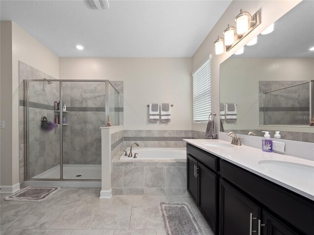 3052 Prelude Ln, Kissimmee, FL 34746 - full bath with a bath, a shower stall, double vanity, and tile patterned floors