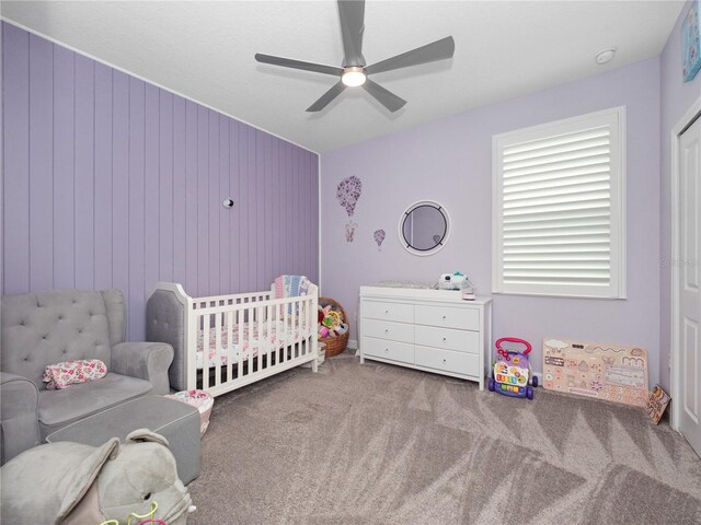 3052 Prelude Ln, Kissimmee, FL 34746 - carpeted bedroom featuring a crib and ceiling fan