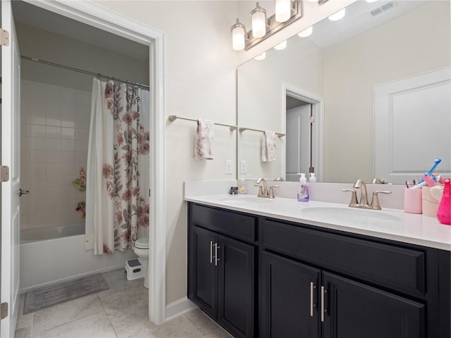 3052 Prelude Ln, Kissimmee, FL 34746 - bathroom with double vanity, toilet, shower / tub combo with curtain, and tile patterned floors