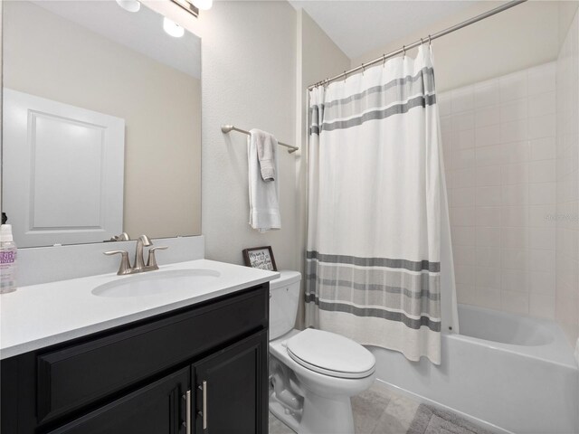 3052 Prelude Ln, Kissimmee, FL 34746 - bathroom featuring toilet, vanity, shower / bath combination with curtain, and tile patterned floors