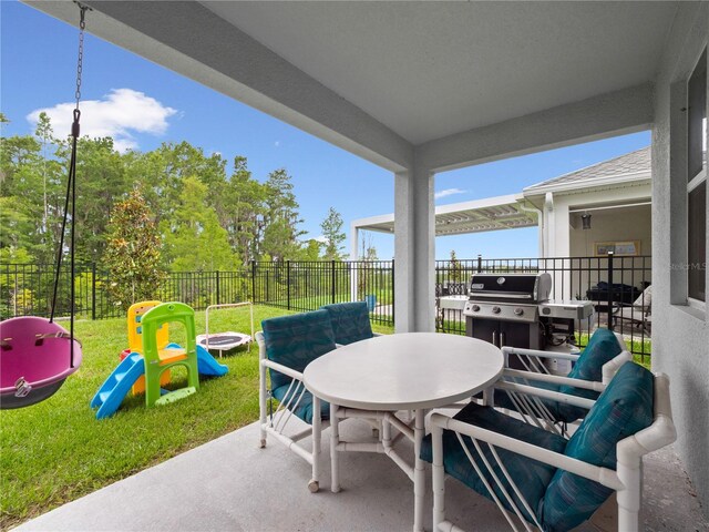 3052 Prelude Ln, Kissimmee, FL 34746 - view of patio / terrace with outdoor dining area and a playground