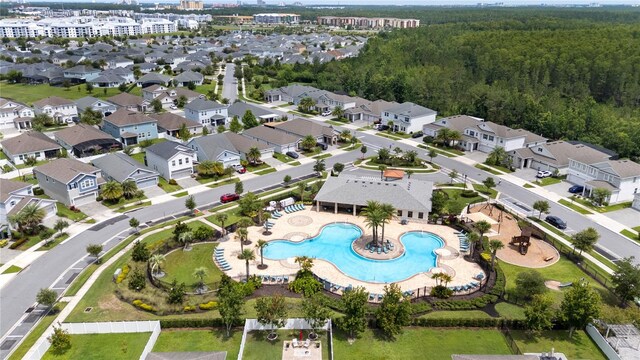 3052 Prelude Ln, Kissimmee, FL 34746 - aerial view of property's location with a pool area and a heavily wooded area