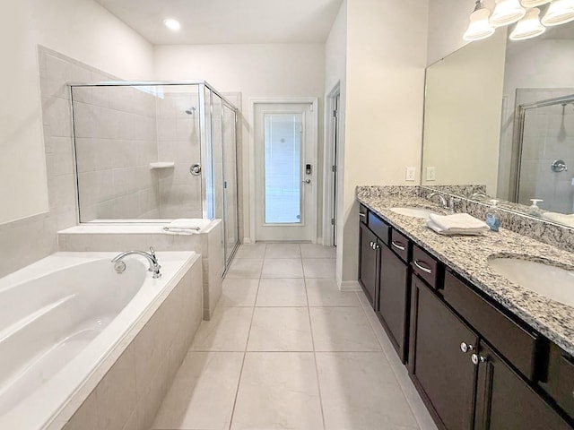 1876 Summer Dr, Davenport, FL 33897 - full bath featuring a bath, a stall shower, double vanity, and tile patterned flooring