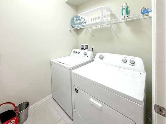 1876 Summer Dr, Davenport, FL 33897 - washroom with independent washer and dryer, light marble finish flooring, and baseboards