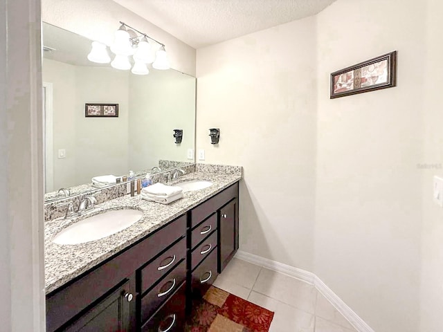 1876 Summer Dr, Davenport, FL 33897 - full bathroom with double vanity, tile patterned floors, a textured ceiling, and baseboards