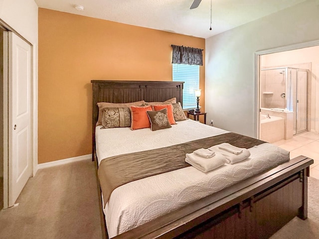 1876 Summer Dr, Davenport, FL 33897 - bedroom with light carpet, connected bathroom, baseboards, and a ceiling fan