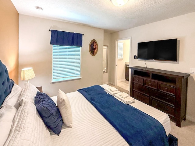 1876 Summer Dr, Davenport, FL 33897 - bedroom featuring light carpet, ensuite bath, and a textured ceiling