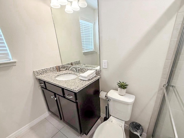 1876 Summer Dr, Davenport, FL 33897 - bathroom with vanity, toilet, baseboards, a shower with shower door, and tile patterned floors