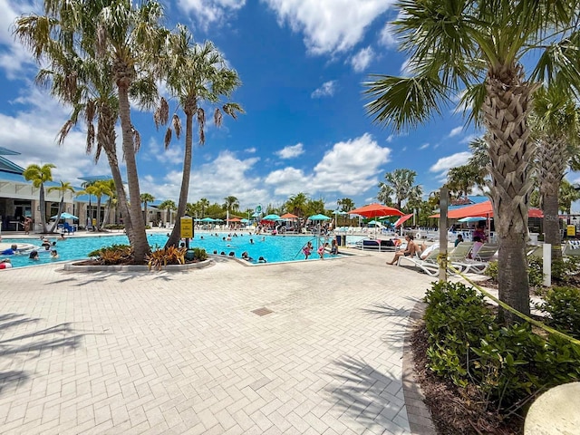 1876 Summer Dr, Davenport, FL 33897 - community pool with a patio area