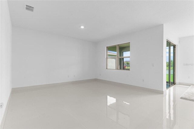 17795 Blazing Star Cir, Clermont, FL 34714 - spare room featuring recessed lighting and tile patterned flooring