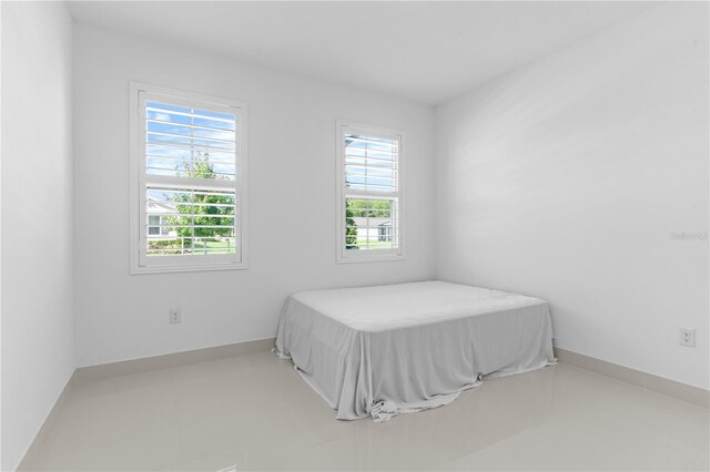 17795 Blazing Star Cir, Clermont, FL 34714 - bedroom with baseboards