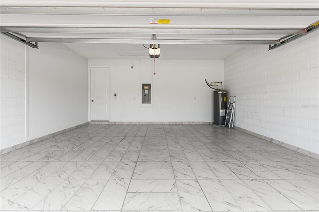 17795 Blazing Star Cir, Clermont, FL 34714 - garage with electric water heater, electric panel, a garage door opener, and concrete block wall