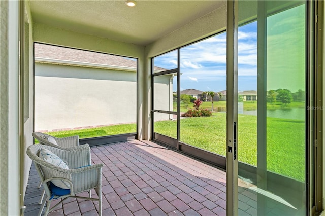 17795 Blazing Star Cir, Clermont, FL 34714 - unfurnished sunroom with a water view