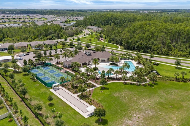 17795 Blazing Star Cir, Clermont, FL 34714 - drone / aerial view of a pool area and a forest