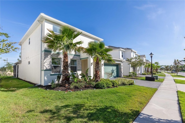 2623 Calistoga Ave, Kissimmee, FL 34741 - view of front of property with stucco siding, driveway, a front yard, and an attached garage