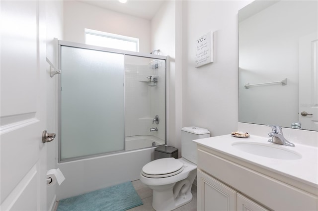 2623 Calistoga Ave, Kissimmee, FL 34741 - full bathroom with vanity, combined bath / shower with glass door, toilet, and tile patterned floors