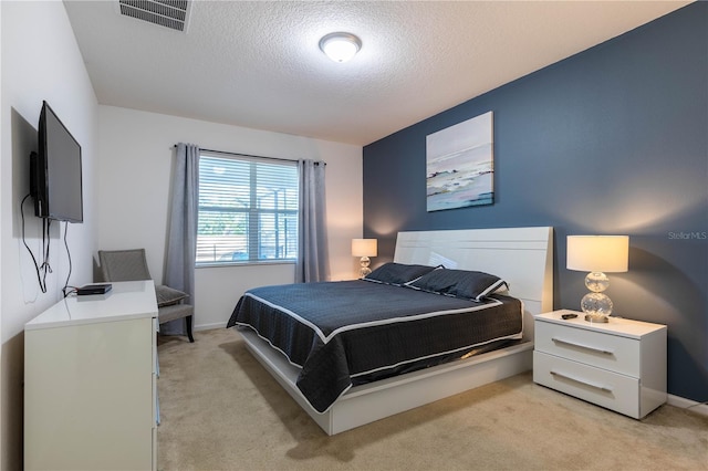 2623 Calistoga Ave, Kissimmee, FL 34741 - bedroom featuring light colored carpet, a textured ceiling, and baseboards