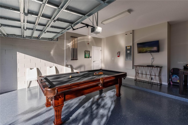 2623 Calistoga Ave, Kissimmee, FL 34741 - rec room with a garage, concrete block wall, billiards table, electric panel, and baseboards