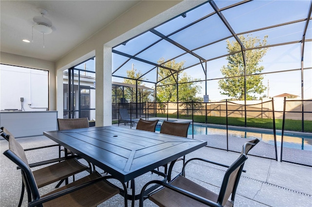 2623 Calistoga Ave, Kissimmee, FL 34741 - fenced backyard featuring a patio area, outdoor dining area, ceiling fan, and a lanai