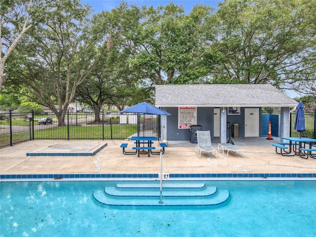 5452 Higgins Way, Orlando, FL 32808 - community pool featuring a patio area and an outdoor structure