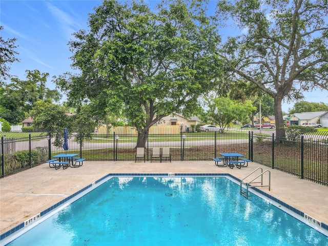5452 Higgins Way, Orlando, FL 32808 - community pool with a patio area