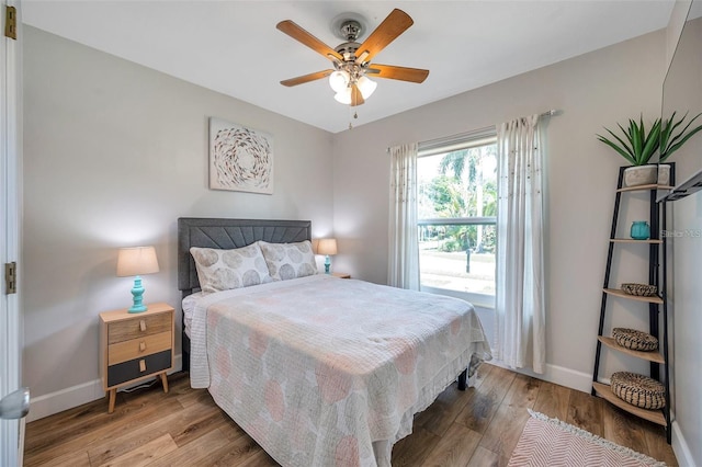 2601 Upton St S, Gulfport, FL 33711 - bedroom featuring baseboards, wood finished floors, and a ceiling fan